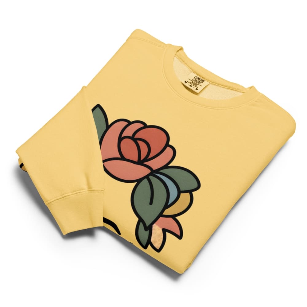 Yellow sweatshirt with a colorful rose design on a white background