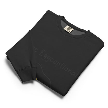 Folded black sweatshirt with 'FOX & JANE' branding on a white background
