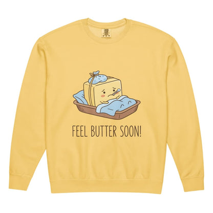 Yellow sweatshirt with a cartoon design of a butter bar in a basket labeled 'Feel Butter Soon!' on a white background.