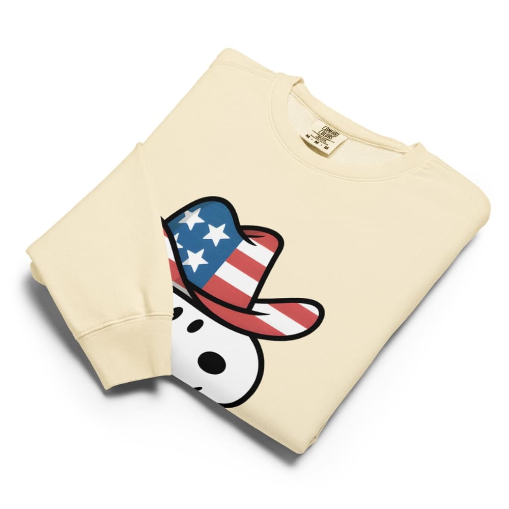 Beige sweatshirt with a graphic of a dog wearing an American flag hat on a white background