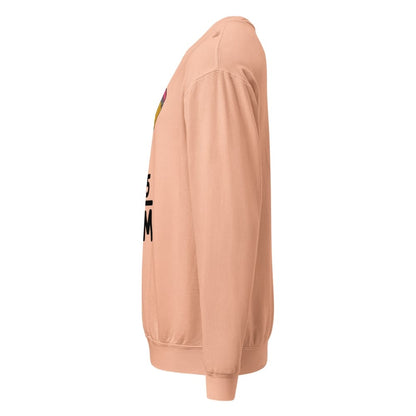 Peach-colored  sweatshirt with text on the sleeve against a white background