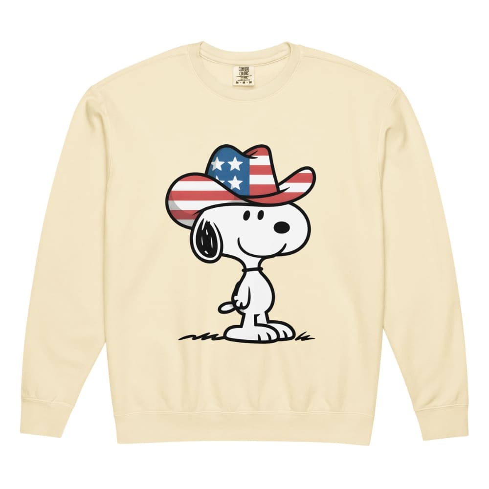 Beige sweatshirt with a cartoon dog wearing an American flag cowboy hat on a white background