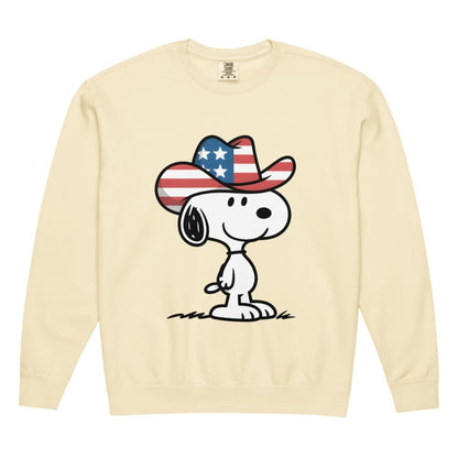 Beige sweatshirt with a cartoon dog wearing an American flag cowboy hat on a white background