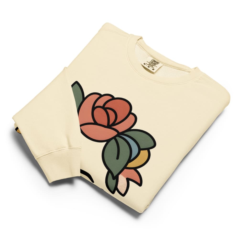 Beige sweatshirt with a colorful rose design on a white background