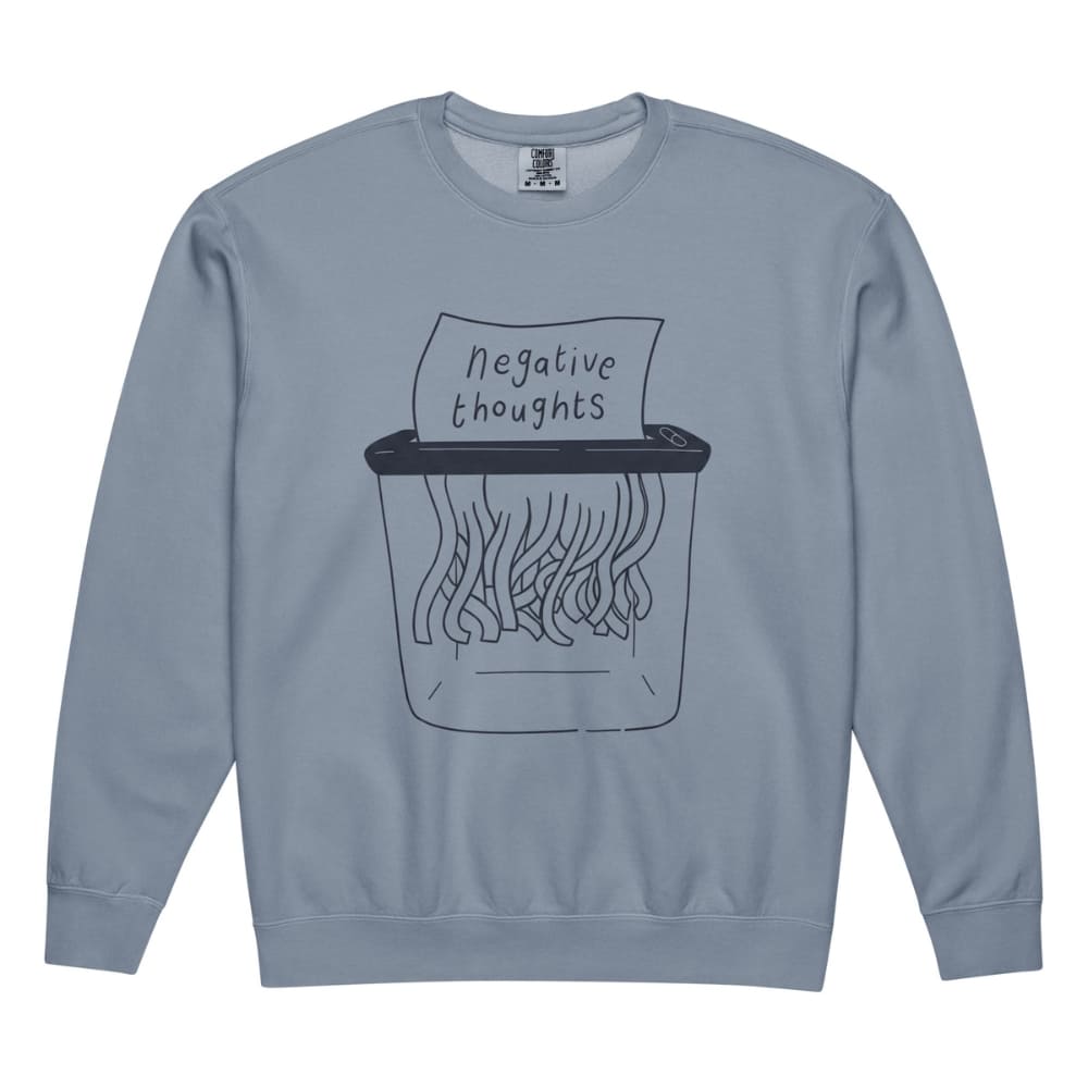 Blue sweatshirt with a graphic of a shredder and 'negative thoughts' text on a white background