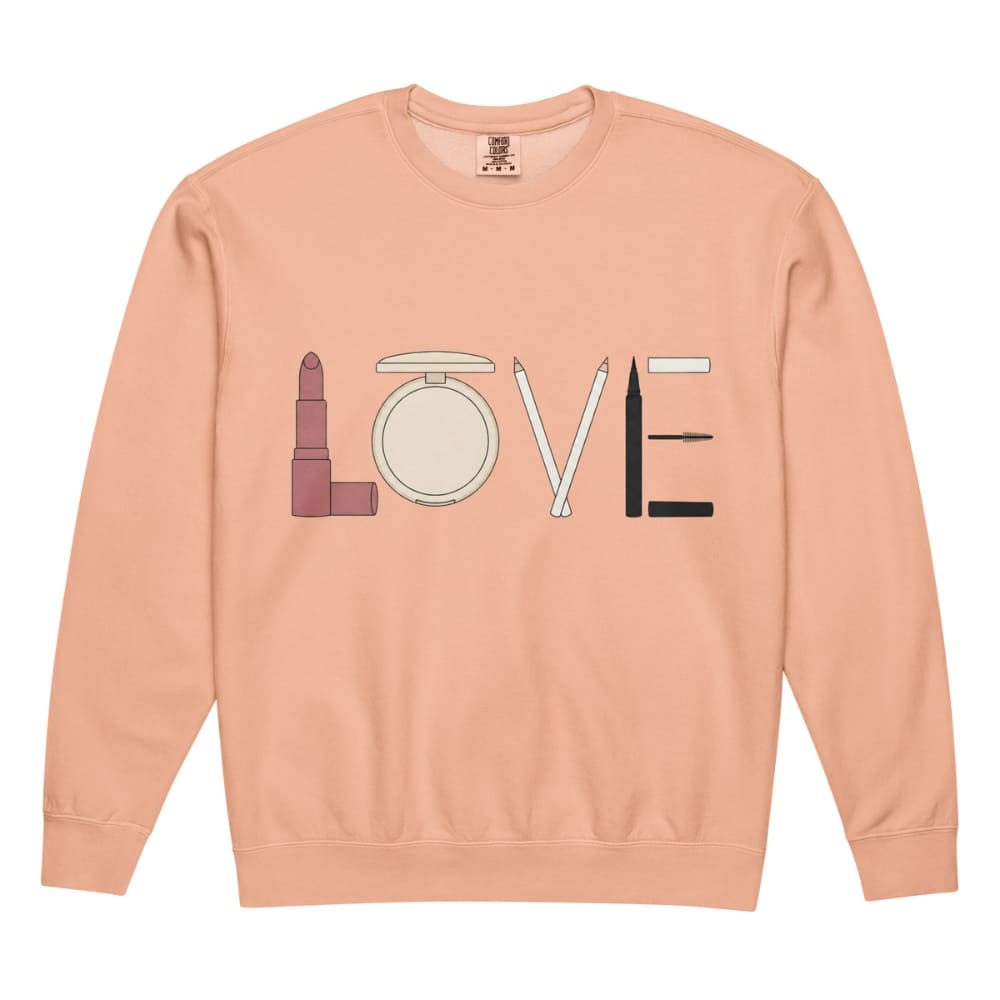 Peach sweatshirt with makeup-themed design on a white background