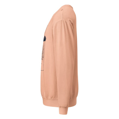 Peach-colored sweatshirt with a logo on the chest against a white background