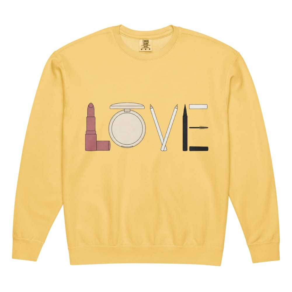 Yellow sweatshirt with makeup icons spelling 'LOVE' on a white background