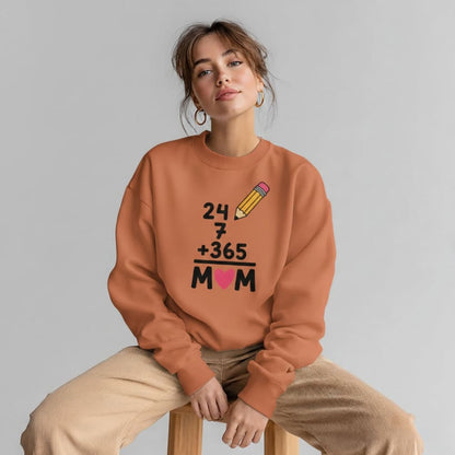 Person wearing a orange sweatshirt with a unique design on a gray background