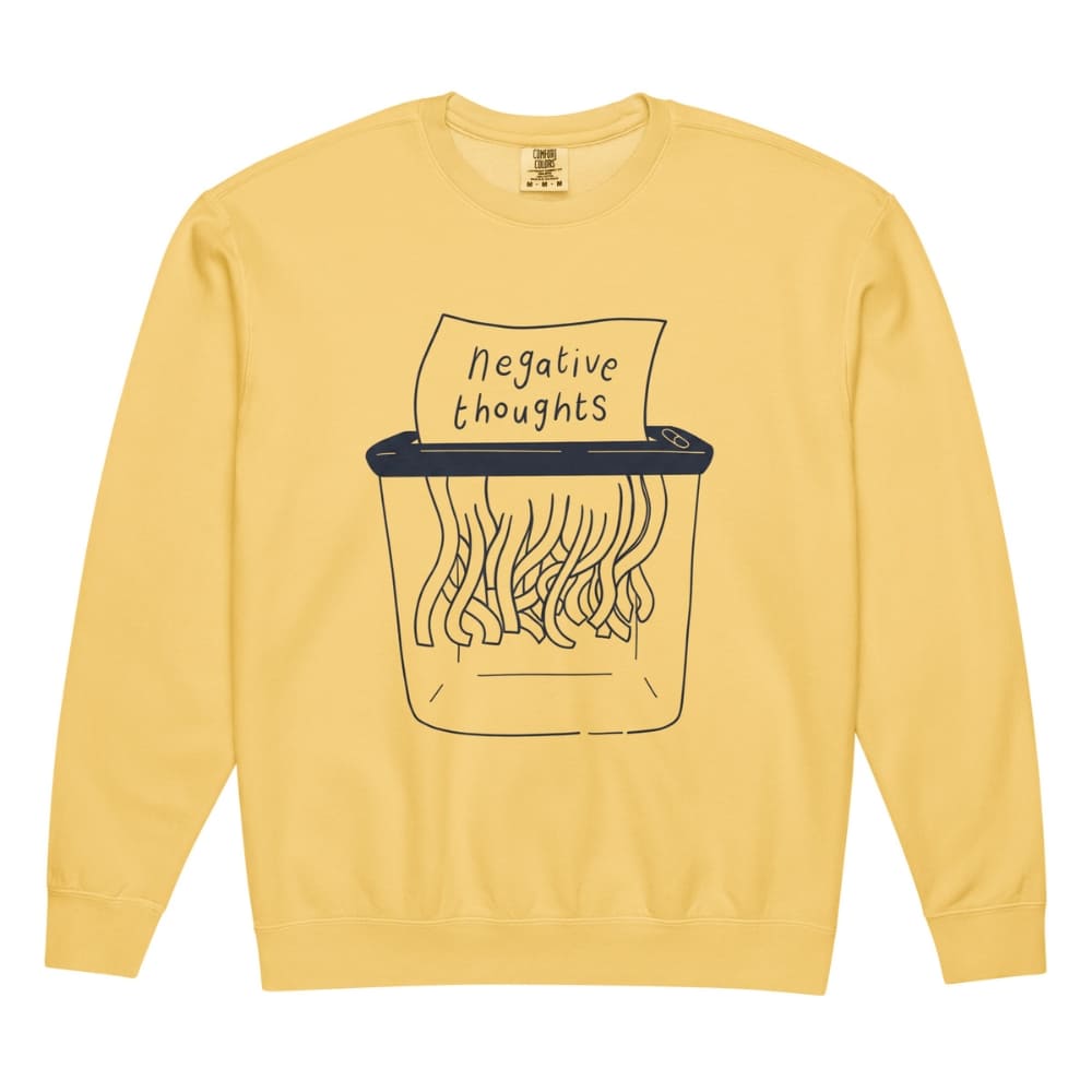 Yellow sweatshirt with a graphic of a paper shredder and 'negative thoughts' text on a white background