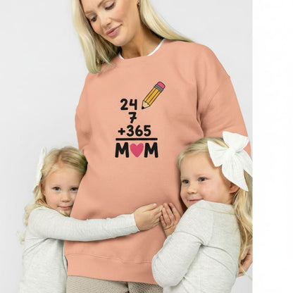 Woman wearing a peach-colored sweatshirt with '24 7 +365 MOM' text and two children hugging her.