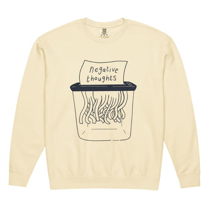 Ivory sweatshirt with a graphic of a shredder and 'negative thoughts' text on a white background