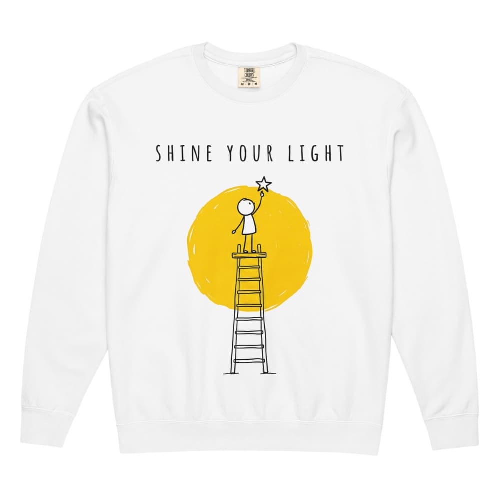 White long-sleeve shirt with 'Shine Your Light' graphic design on a white background