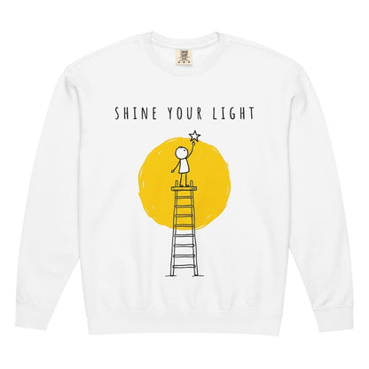 White long-sleeve shirt with 'Shine Your Light' graphic design on a white background