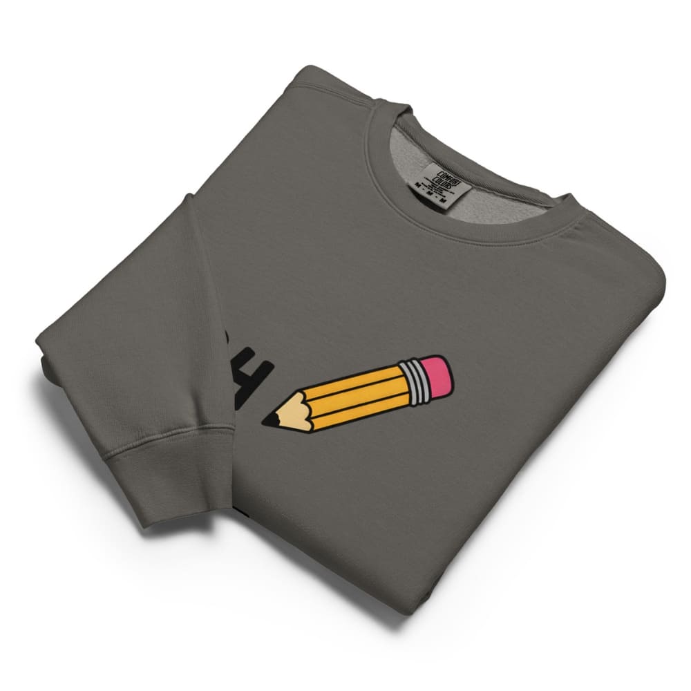Folded gray sweatshirt with a pencil graphic on a white background