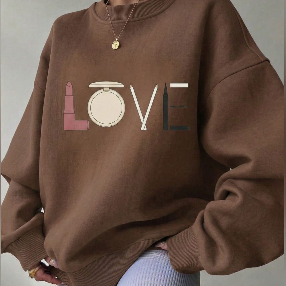 Brown sweatshirt with makeup-themed design spelling 'LOVE'
