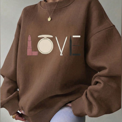 Brown sweatshirt with makeup-themed design spelling 'LOVE'