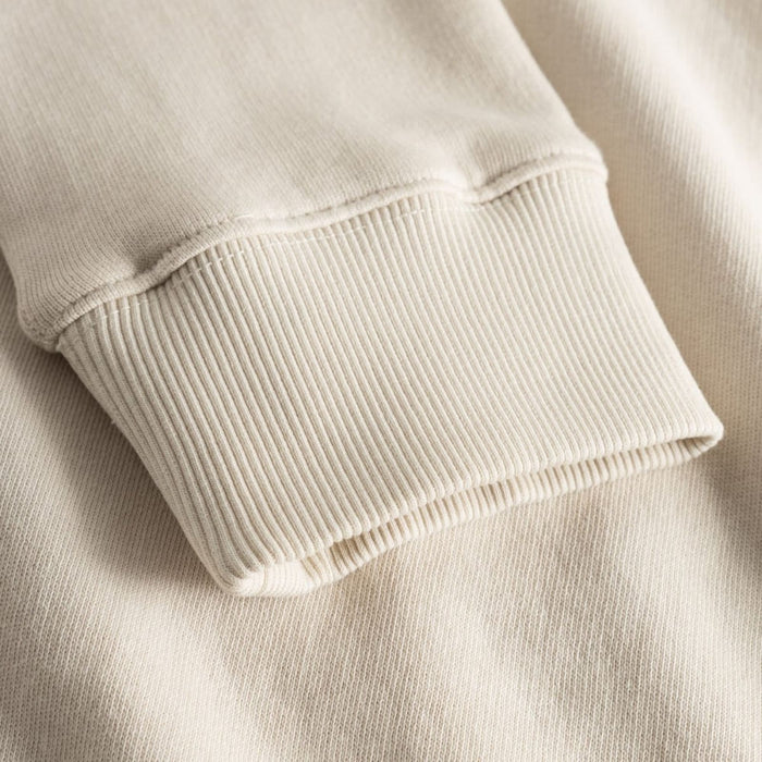 Close-up of the ribbed cuff on a garment-dyed Comfort Colors 1566 sweatshirt in cream