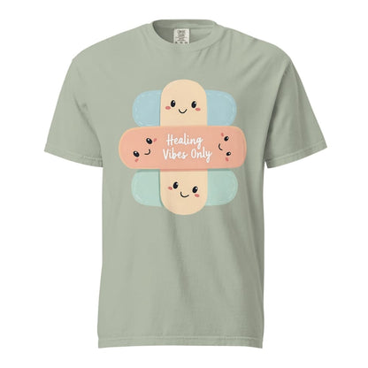 Light green t-shirt with cartoon bandages and 'Healing Vibes Only' text on a white background