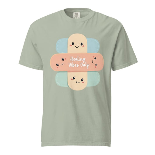 Light green t-shirt with cartoon bandages and 'Healing Vibes Only' text on a white background