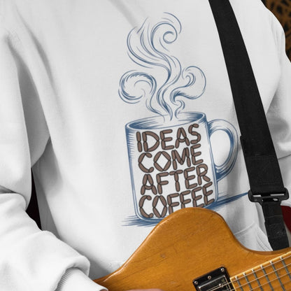 White sweatshirt with a graphic of a coffee cup and 'Ideas Come After Coffee' text, held by a person with a guitar.