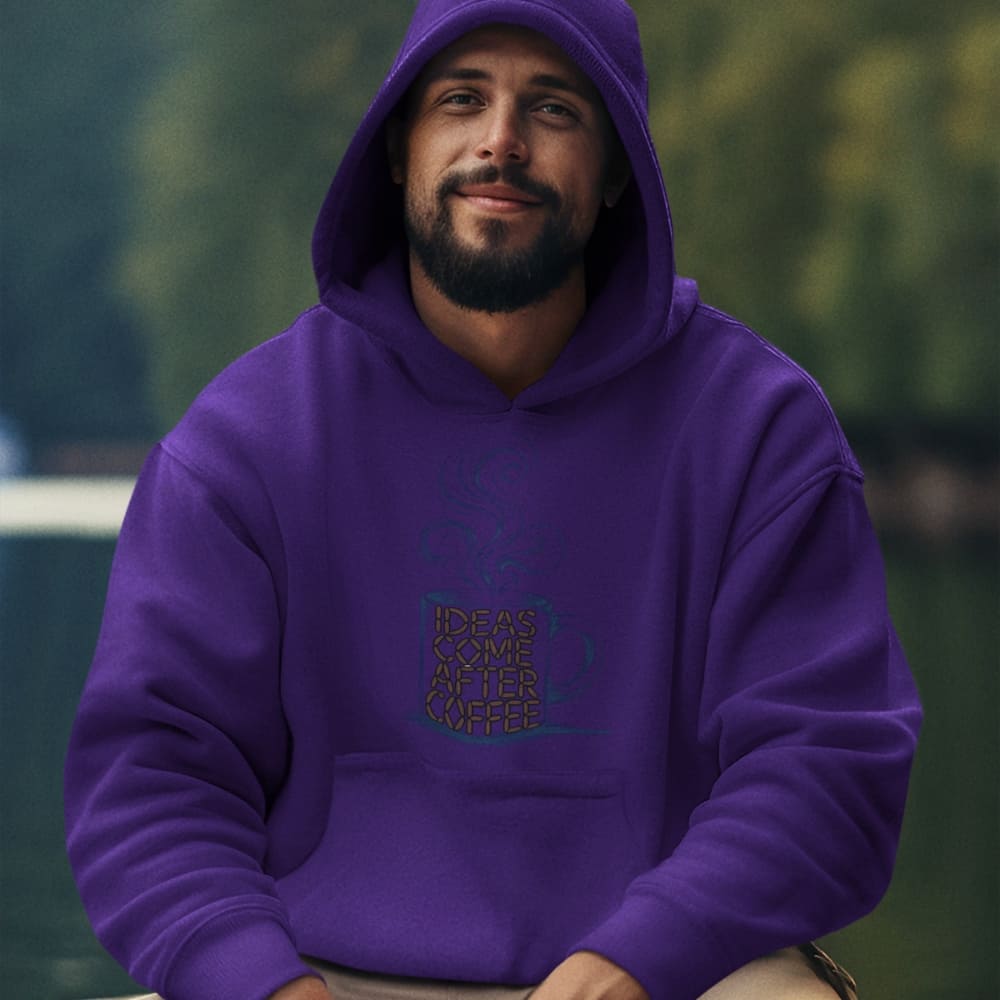 Man wearing a purple hoodie with text design, sitting outdoors.