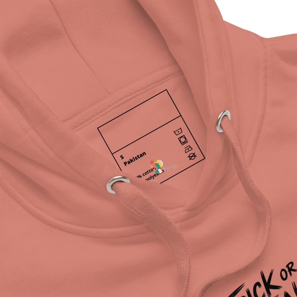 Close-up of a pink hoodie with a label on the chest area.