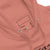 Close-up of a pink hoodie with a label on the chest area.
