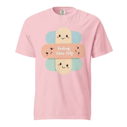 Pink t-shirt with cartoon bandages and 'Healing Vibes Only' text on a white background