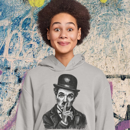 Person wearing a hoodie with a graphic of a famous character against a textured wall background