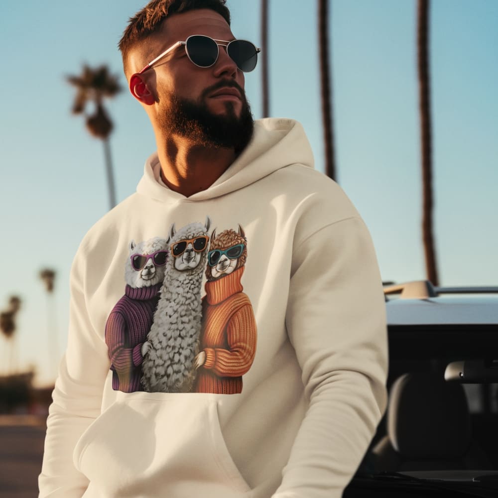 Man wearing a hoodie with llama graphics and sunglasses, standing outdoors.