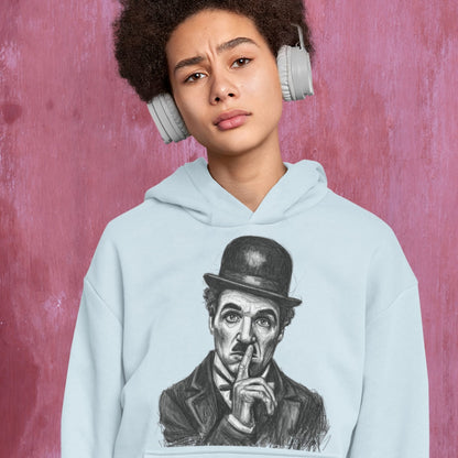 Person wearing a light blue hoodie with a graphic of a historical figure, against a pink textured background
