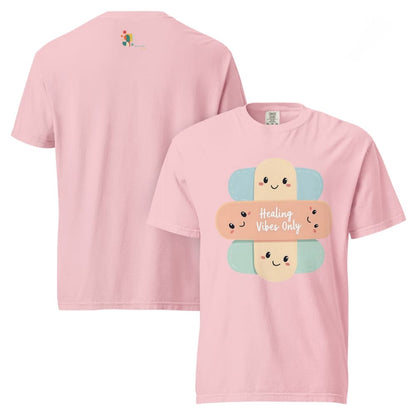 Pink t-shirt with cartoon bandages and 'Healing Vibes Only' text on a white background