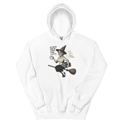 White hoodie with a graphic of a witch on a broom and text on a white background