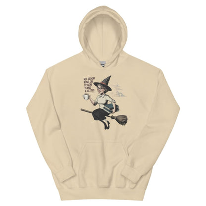 Beige hoodie with a graphic of a witch on a broom and text on a white background