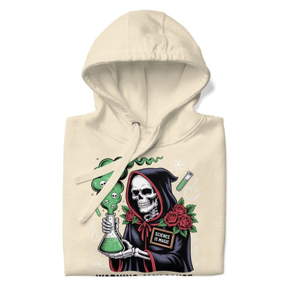 Beige hoodie with a graphic design of a skeleton holding a beaker, green liquid, roses, and 'Science is Magic' sign.