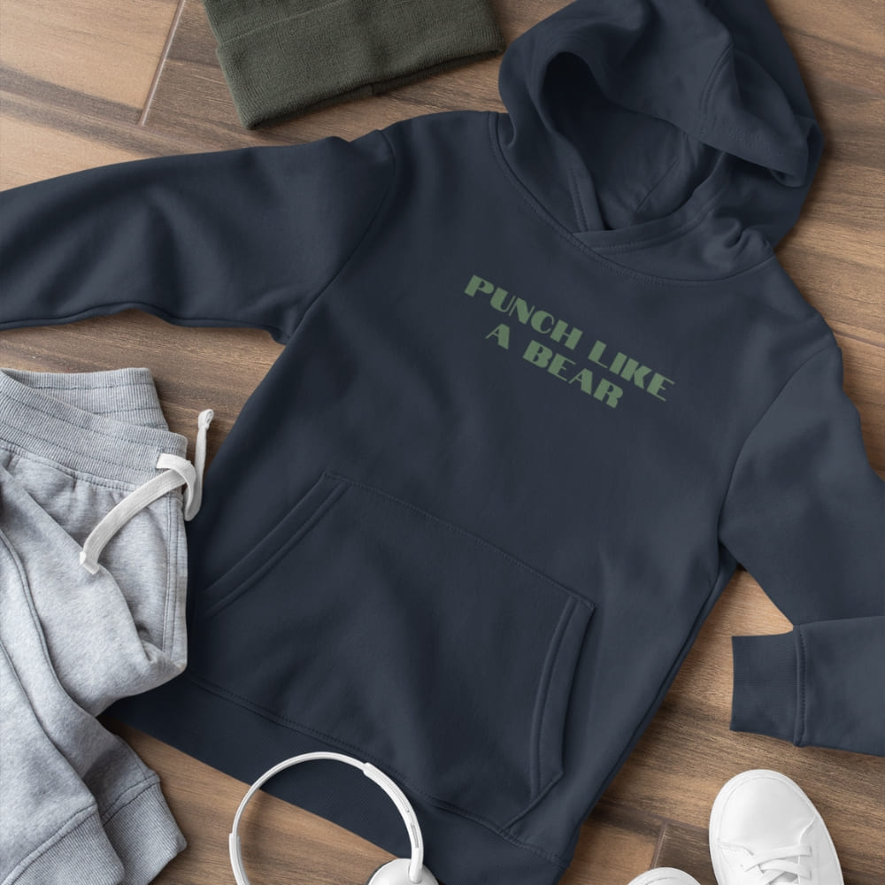 Navy hoodie with 'Punch Like a Bear' text on a wooden surface with gray sweatpants and white sneakers.