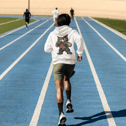 Person running on a blue track with a bear graphic hoodie