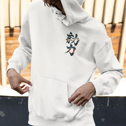 Person wearing a white hoodie with colorful text design against a blurred background