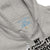 Gray hoodie with text and graphics on the chest area