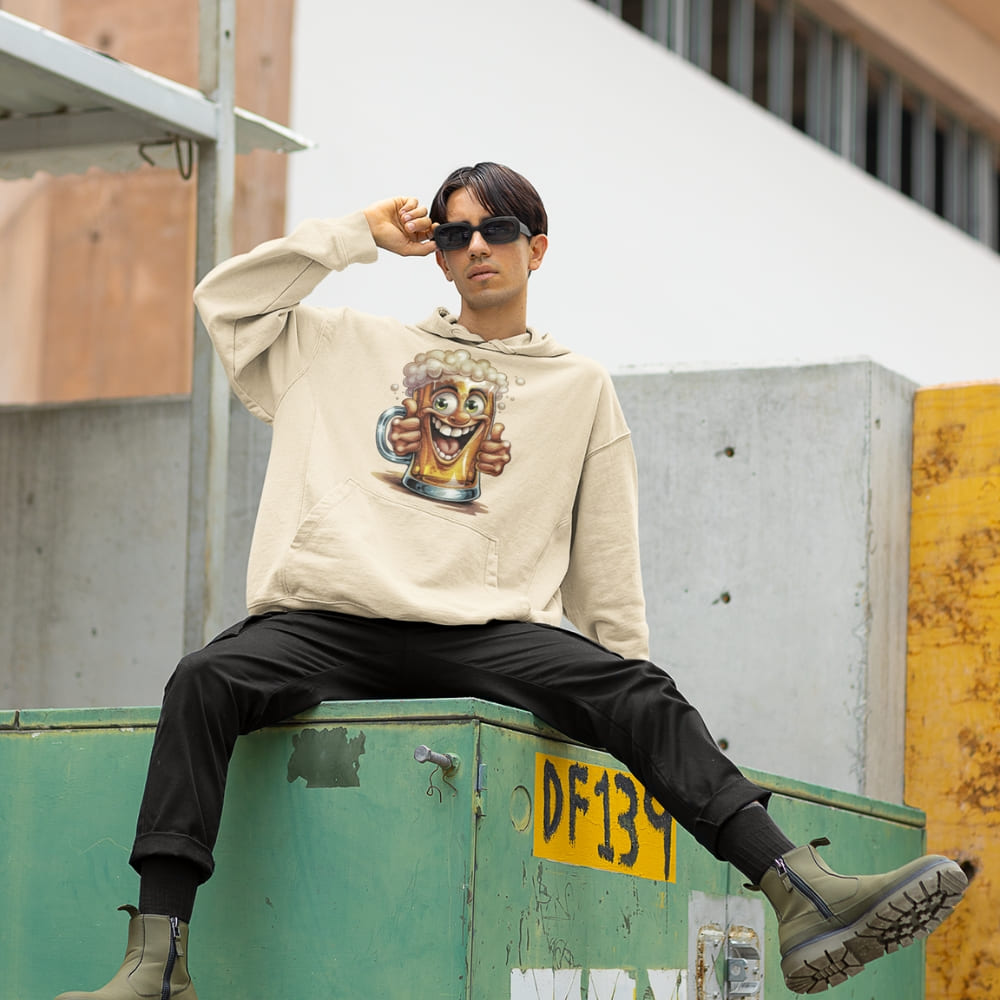 Person wearing a hoodie with a graphic design, sitting on a green metal container outdoors.
