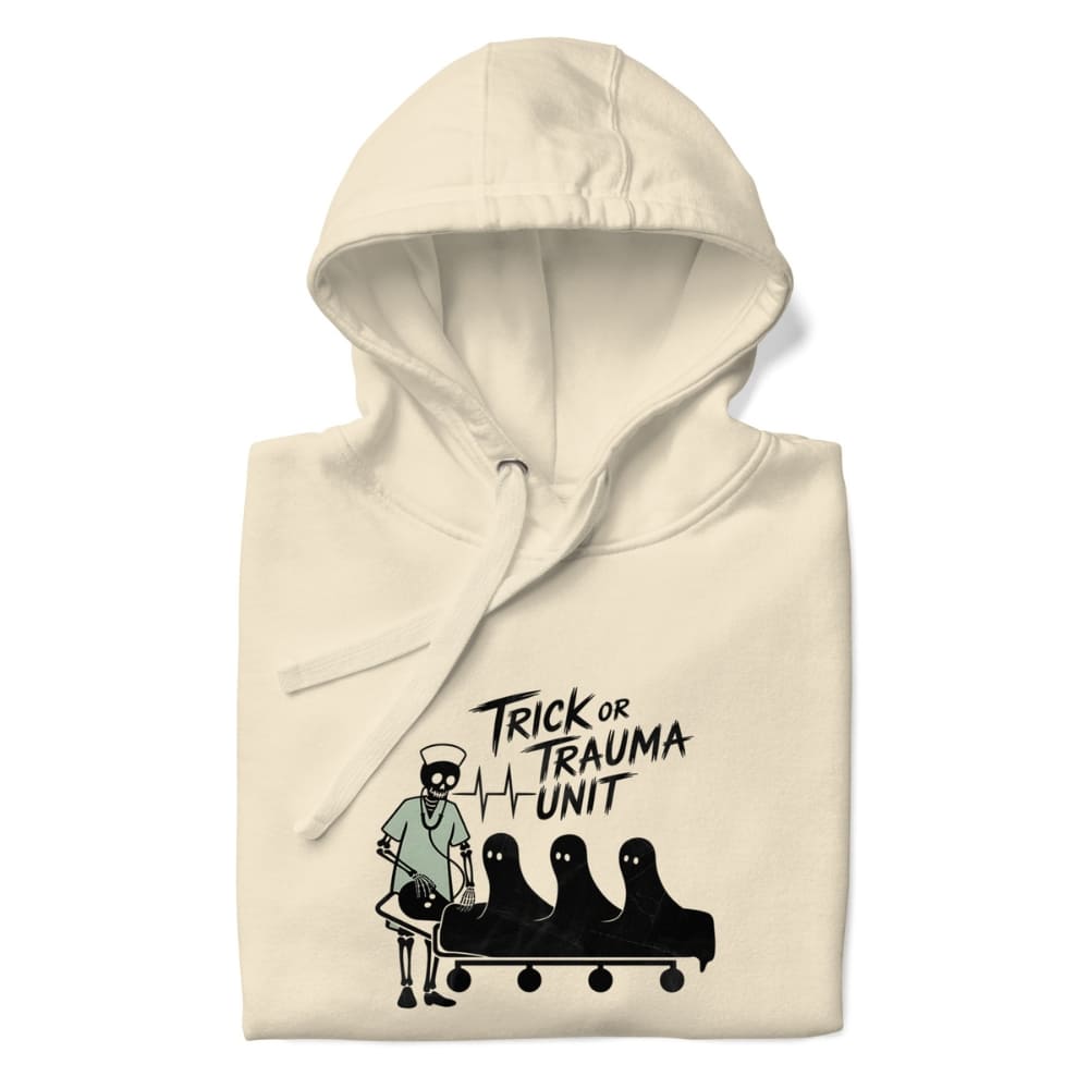 Beige hoodie with 'Trick or Trauma Unit' graphic design on a white background