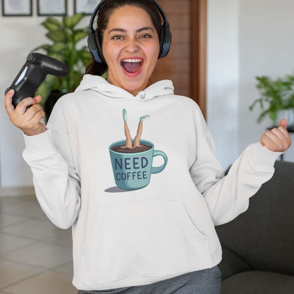 Person wearing a hoodie with a coffee cup graphic and text, holding a gaming controller.