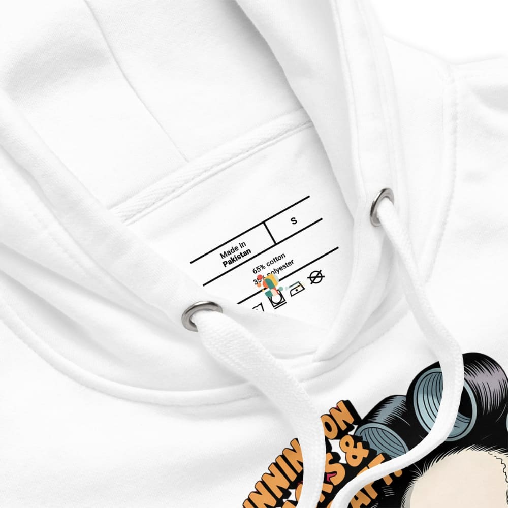 Close-up of a white garment with a label and a colorful graphic design on a white background.