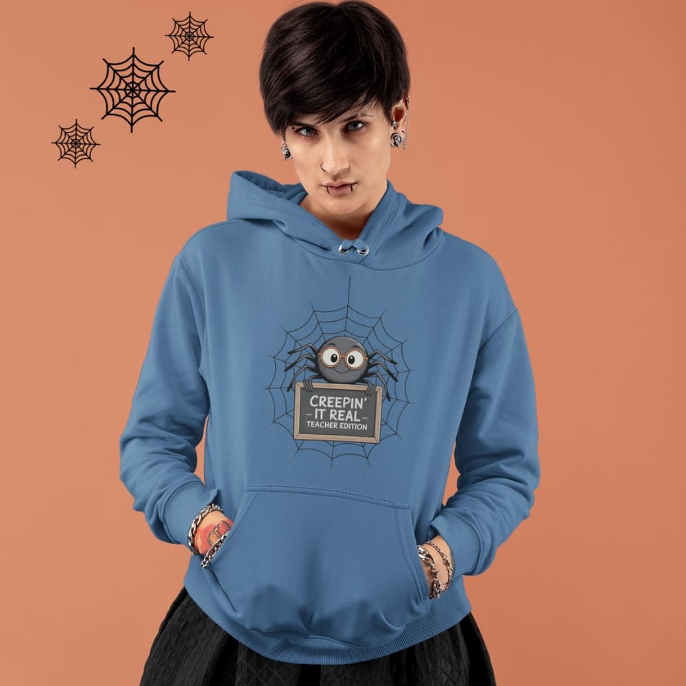 Person wearing a blue hoodie with a spider graphic and text on an orange background
