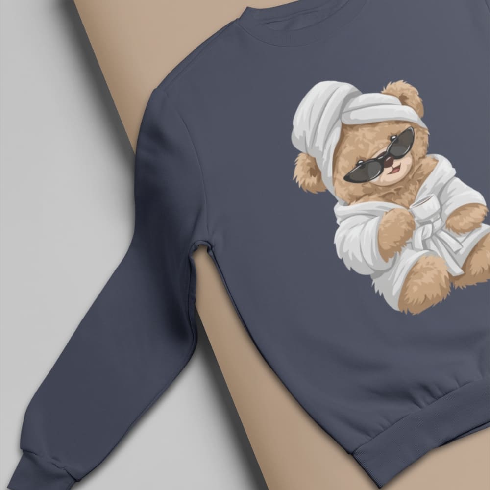 Navy blue sweatshirt with a teddy bear graphic on a neutral background