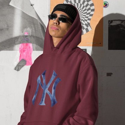 Person wearing a maroon hoodie with a blue logo in front of a collage of images.