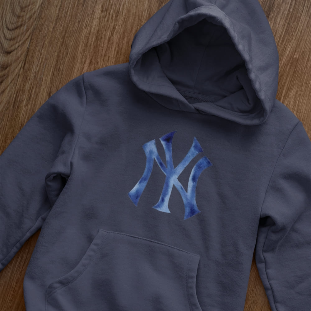Navy blue hoodie with blue logo on a wooden surface