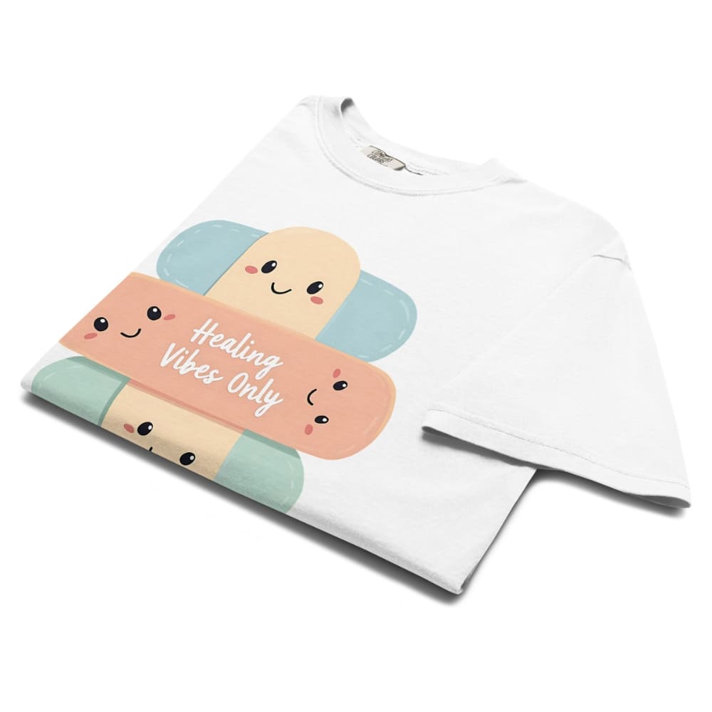 White t-shirt with colorful bandaid design and 'Healing Vibes Only' text on a white background