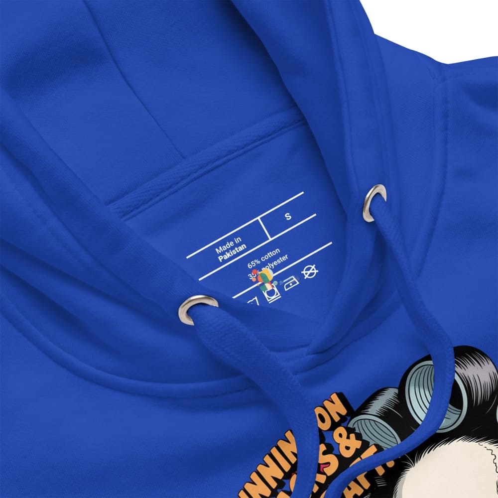 Close-up of a blue hoodie with a label and part of a graphic design visible.